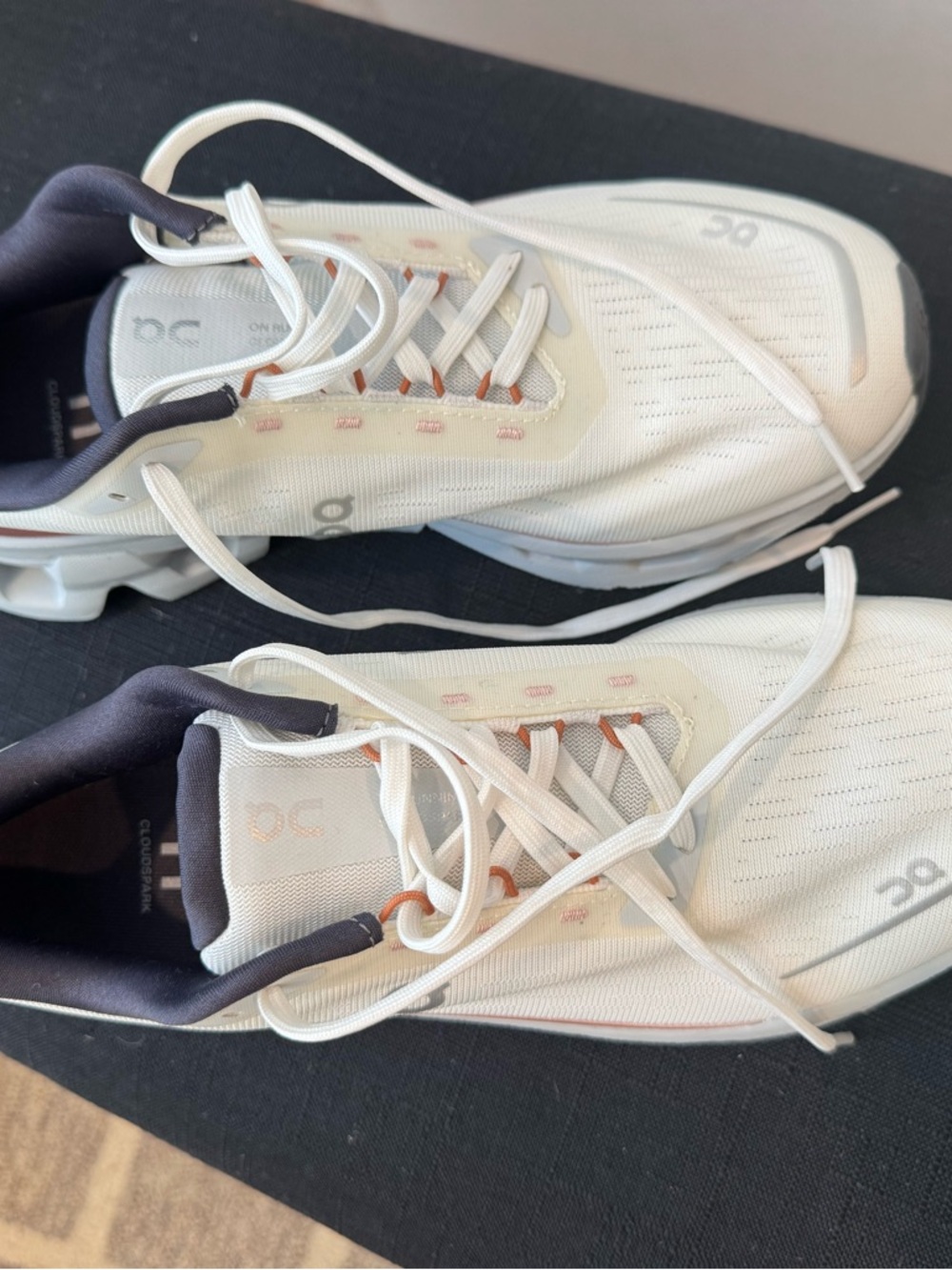 On Running Women’s Cloudnova Sneakers in White with Black and Orange Accents